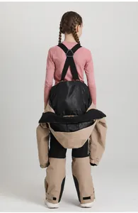 Detailed back view of children's ski suit with adjustable straps and protective hood