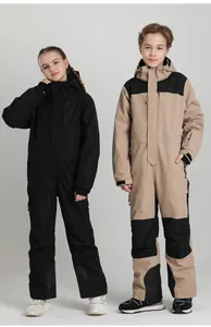 Detail view of the waterproof functional fabric and cuffs on kids ski suit