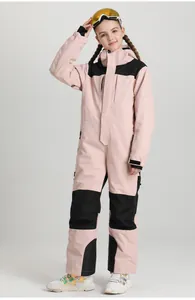 Detail of pink and black kids' one-piece ski suit with high collar and hood