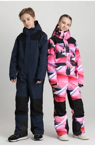 Detail view of kids one-piece ski suits showing waterproof fabric and professional zippers