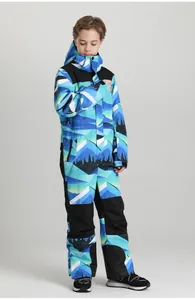Detail view of children's one-piece ski suit with mountain print and waterproof fabric