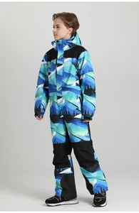 Detail view of children's one-piece ski suit with windproof hood and mountain print