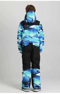 Rear view of children's professional ski suit with blue mountain print and black panels
