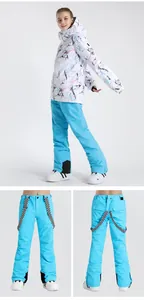 Detail of blue ski pants featuring adjustable checkerboard suspenders and waterproof fabric