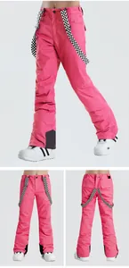 Detailed views of pink waterproof ski pants with adjustable checkerboard suspenders