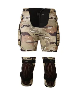 Close-up of camouflage padded impact shorts and matching knee pads for snow sports