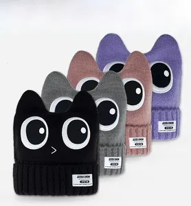 Detailed view of ribbed knit ski beanies with cartoon cat ears in multiple colors