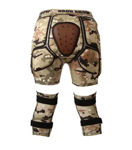 Protective padded shorts and knee pads set in camouflage for skiing and snowboarding