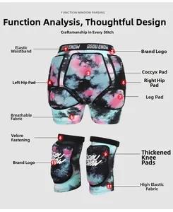Detail view of pink tie-dye ski protective gear showing hip pads and knee protectors