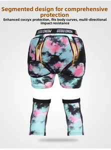 Segmented padding on ski protective shorts for enhanced coccyx and hip protection