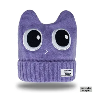 Detailed knit texture of taro purple ski hat with cartoon eyes and ear flaps