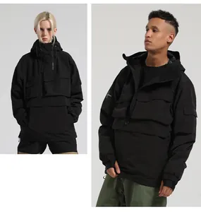 Detail of waterproof black hooded ski jacket featuring multi-pocket utility design