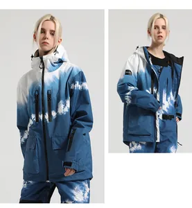 Detail of blue and white tie-dye ski suit jacket showing waterproof fabric and utility pockets