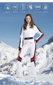 Detail of white women's ski suit showing waterproof fabric and functional icons in snow