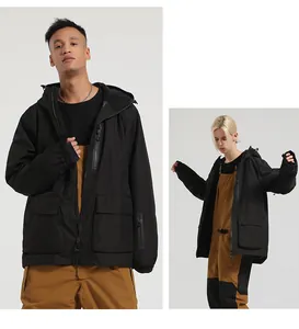 Detail showing waterproof zippers and tactical pockets on black hooded ski jacket