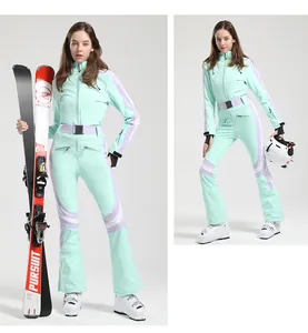 Detail of mint green slim fit ski suit featuring waterproof fabric and purple stripes