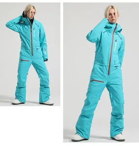 Detail view of bright blue one-piece ski suit with waterproof zippers and windproof hood