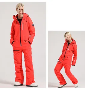 Detail of red one-piece ski suit featuring waterproof zippers and windproof hooded design
