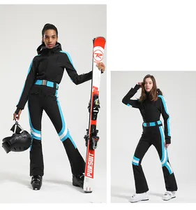 Detailed close-up showing the slim-fit waterproof design of black one-piece women's ski suit