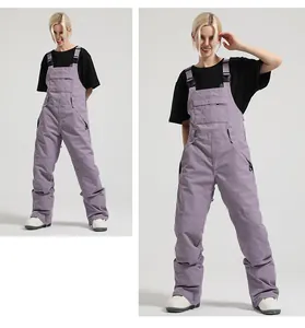 Detail of lavender waterproof ski bib pants with adjustable straps and front pocket