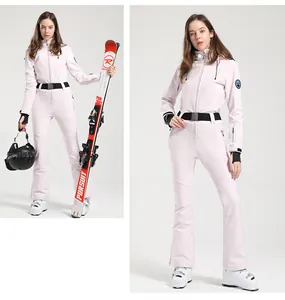 Pink one-piece ski suit with black adjustable waist belt and professional hood detail