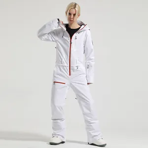 Women's white one-piece ski suit with red zippers, waterproof hooded jumpsuit for snowboarding