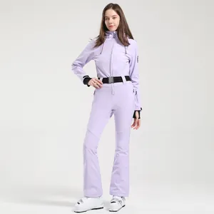 Slim fit lavender women's one-piece ski suit with hood and black waist belt