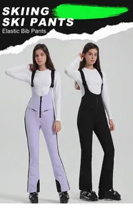 Stretch ski bib pants in purple and black with adjustable straps and zipper pockets