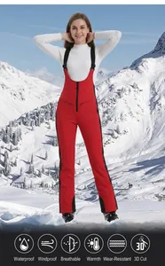 Red waterproof women's ski bib pants with thermal fleece lining for outdoor winter snow sports