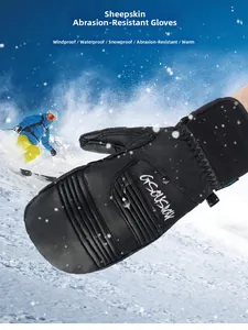 Close-up of waterproof black leather mittens with water droplets on the surface
