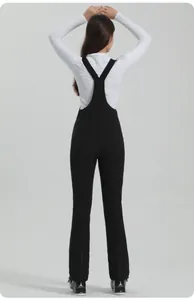 Rear view of slim fit black waterproof ski bib pants with Y-back straps and thermal lining