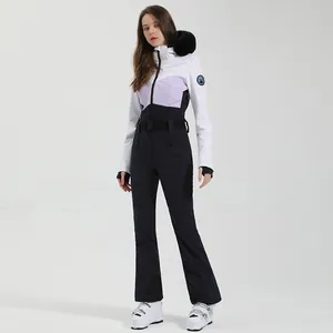 Tuta da sci intera da donna impermeabile con cappuccio in pelliccia e design color-block