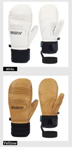 Detail of waterproof ski mittens in white and yellow with wrist straps and joint flexibility