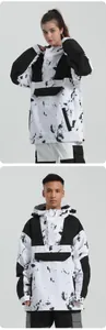 Detail view of hooded waterproof anorak ski jacket with stylish black ink splash patterns