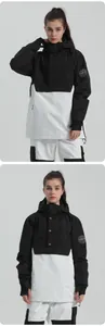 Close-up of black and white color-block ski jacket featuring hood and brand badge
