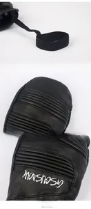 Detail of waterproof ski gloves featuring knuckle protection and elastic wrist leash