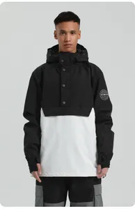Detail of waterproof ski jacket with contrast hood and embroidered badge on sleeve