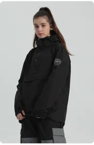 Detail of black hooded anorak ski jacket featuring front pocket and embroidered logo patch