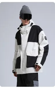 Close-up of men's waterproof ski jacket with contrast panels and functional utility pockets