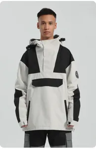 Detail of hooded color-block ski anorak featuring adjustable cuffs and large front pocket