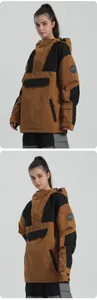 Detail of waterproof ski jacket featuring contrast color panels and large utility pocket