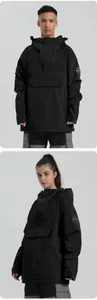 Detail view of black waterproof ski anorak showing hooded neck and front flap pocket