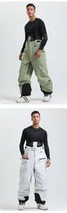 Detail of waterproof ski bib pants with adjustable straps and reinforced knee patches