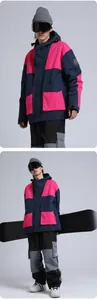 Detail of waterproof ski jacket with contrast color blocks and large utility pockets