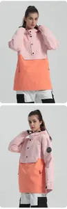 Pink and orange hooded ski jacket featuring windproof fabric and contrast patch detail