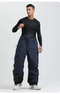 Detail of professional dark blue waterproof ski bib pants with adjustable straps and zipper