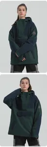 Detail of green and navy ski anorak with sleeve patch and hooded half-zip design