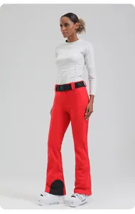 Detail of slim-fit red ski pants with black nylon belt and white thermal base layer shirt