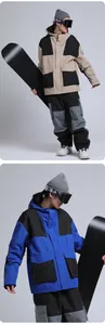 Detail view of waterproof ski jacket with contrast panels and functional utility pockets