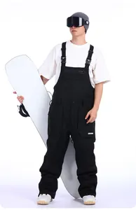 Front view of professional waterproof black ski bib pants with adjustable straps and pockets